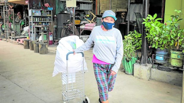 “Nanay” Vicky, a waste collector in General Trias, Cavite, is among the beneficiaries of the Coca-Cola and Plastic Bank partnership.