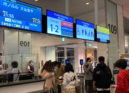 Travelers lining up at Tokyo's Haneda Airport