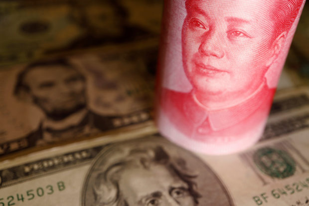 Dollar and Chinese yuan banknotes