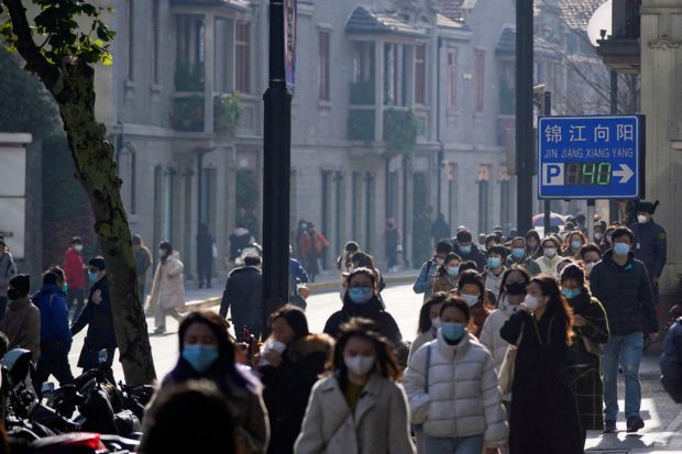 People wearing mask on street in Shanghai
