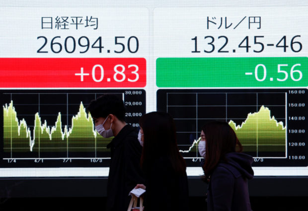 Electric monitors display Nikkei stock index