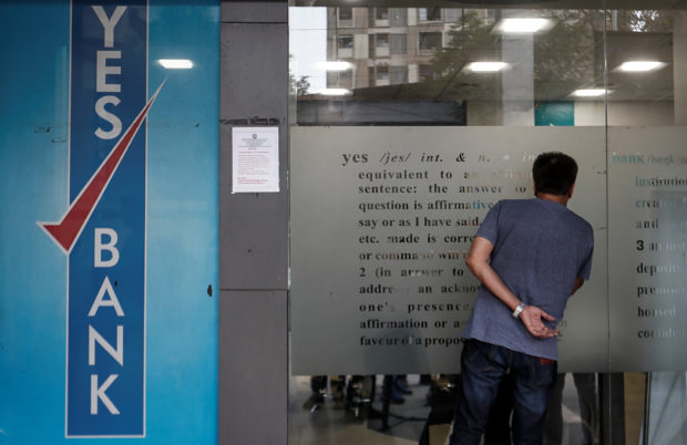 A customer looks into a Yes Bank branch