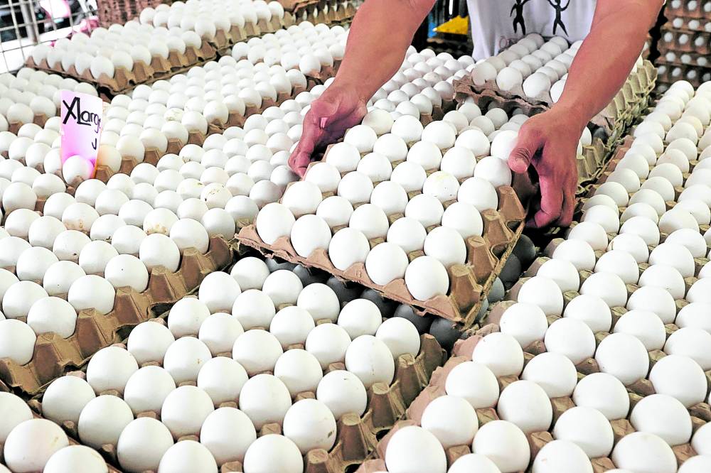 COSTLIER SOURCE OF PROTEIN A vendor mans his store which is selling eggs—whose prices have been rising of late—in Tondo, Manila. —GRIG C. MONTEGRANDE