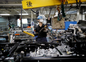 An employee at Kawasaki factory's assembly line