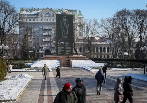People walk in a park in central Kyiv