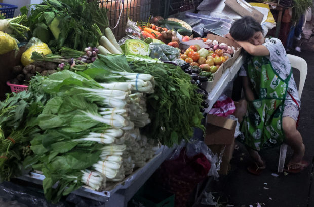 High prices of farm products such asthese vegetables at a stall in Kamuning Market in Quezon City contributed to the surge in inflation. STORY: Food cost, utilities, rent drive inflation to 8.7%