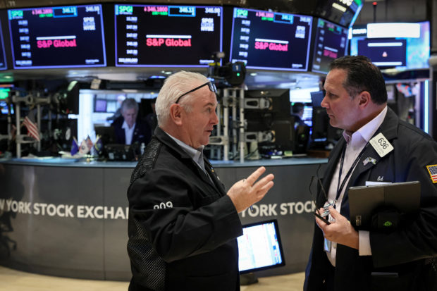 Traders on the floor of the NYSE