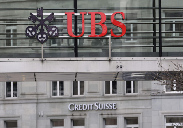Logos of UBS and Credit Suisse