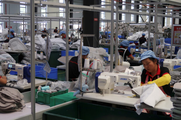 Workers at the production line of Kids II in China