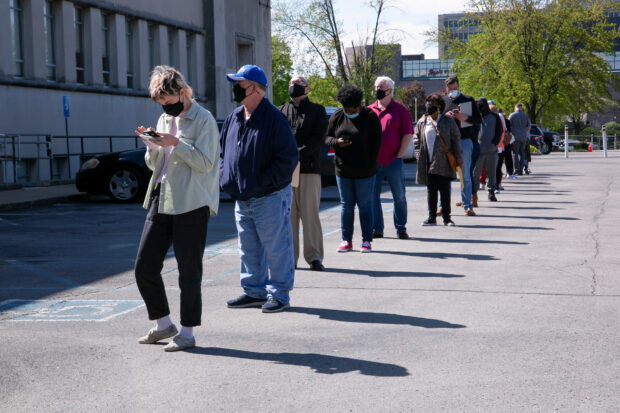 People line up outside a career center in Louisville , U.S.