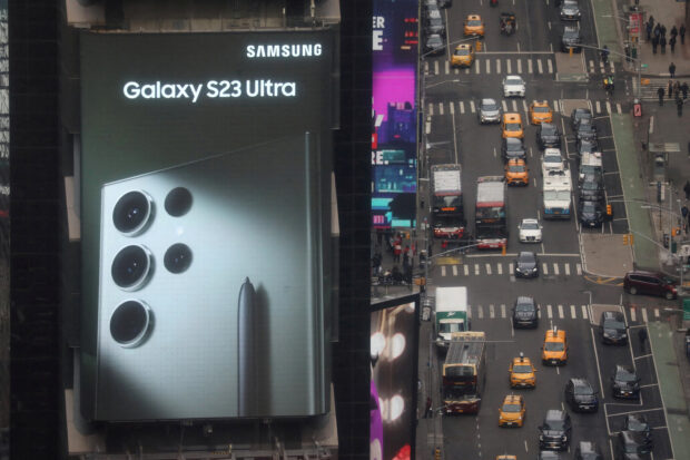 Traffic passes at Samsung electronic billboard in Times Square area of Manhattan