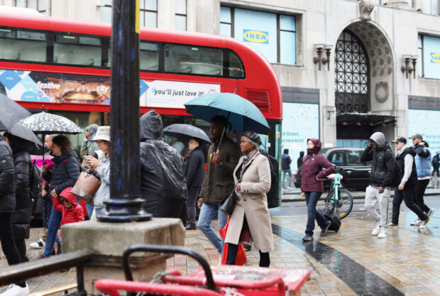 People walkin go Oxford Street in London
