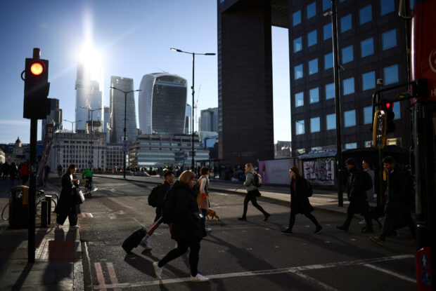 People crossing the road  in London's financial district