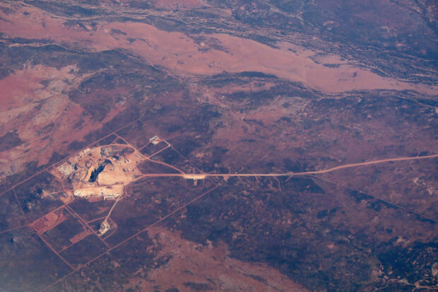 A road leads to an open-cut mine in  northwest of Western Australia
