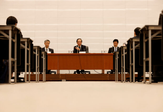 Bank of Japan officials hold a press conference in Tokyo