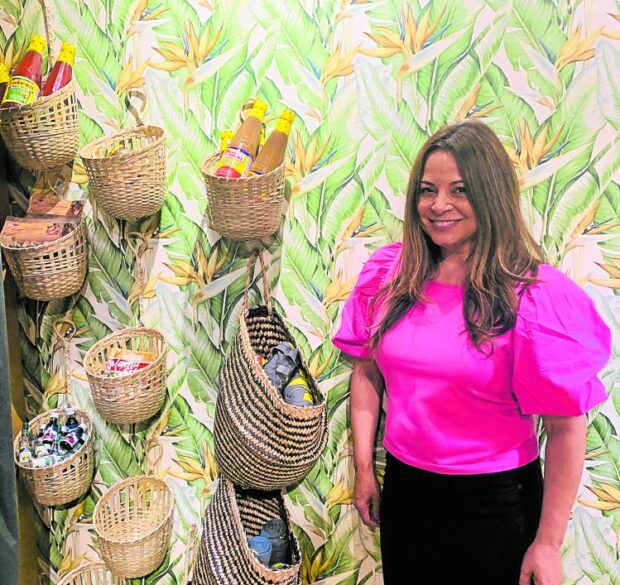 Chef Partrice Cleary of Purple Patch displaysFilipino cupboard essentials on a wall of her restaurant.