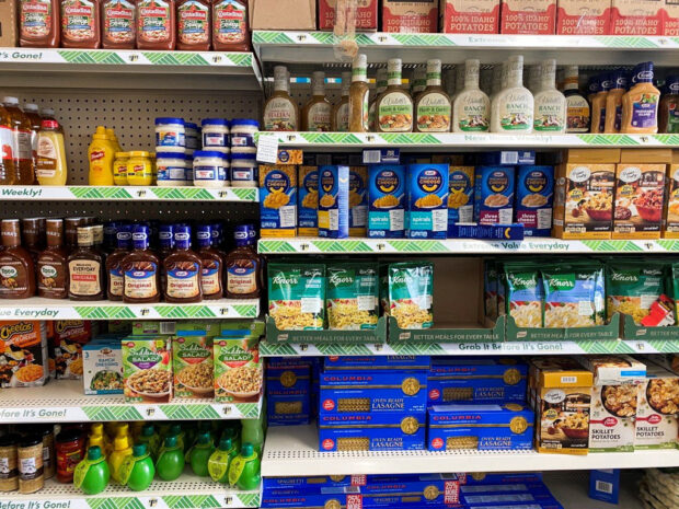 Packaged food for sale on shelves at Dollar Tree store