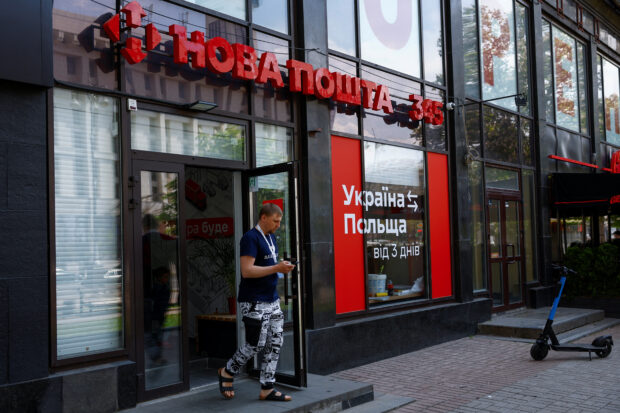 Man leaves a branch of Nova Poshta delivery service in Kyiv