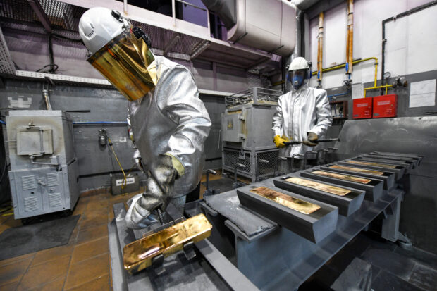 Employees cast ingots at Krastsvetmet precious metal plant in Russia