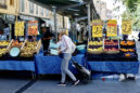 A woman shops at a market in Nice