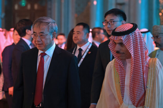Saudi Foreign Minister Faisal bin Farhan al-Saud and CPPCC Vice Chair Hu Chunhua