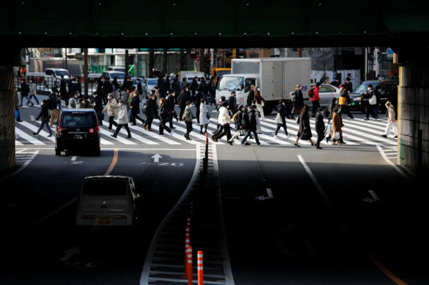 People walking on a pedestrian crossing in Tokyo