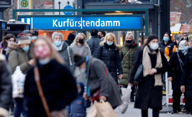 People walk at Kurfurstendamm shopping boulevard in Berlin