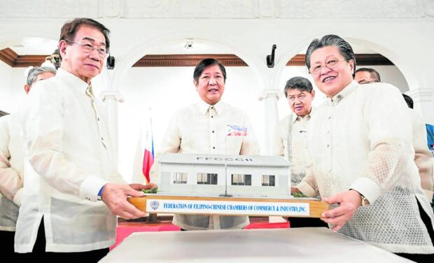 From left: FFCCCII EVP Victor Lim, President Ferdinand R. Marcos Jr., FFCCCII president Dr. Cecilio K. Pedro and FFCCCII honorary president Dr. Henry Lim Bon Liong in Malacañan Palace with the scale model of FFCCCII public schools for donation nationwide.  PHOTO BY KJ ROSALES, PPA POOL