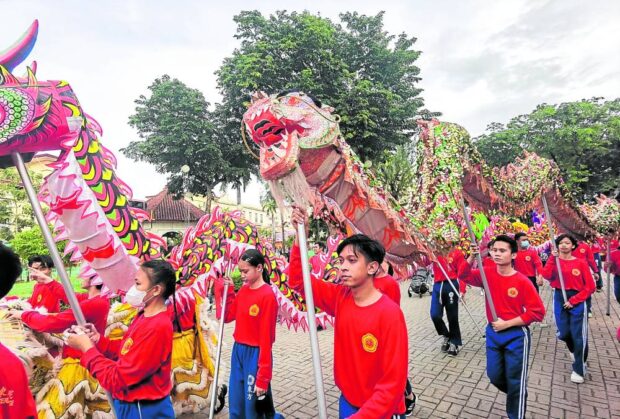  Students from a Chinese school in Cebu City prepare to perform the traditional Lion Dance during the first-ever Red Lantern Festival in Cebu City on Jan. 21, 2023, the eve of the Chinese New Year. CARBON PUBLIC MARKET FACEBOOK PAGE