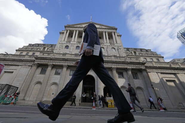 Man walks past the Bank of England