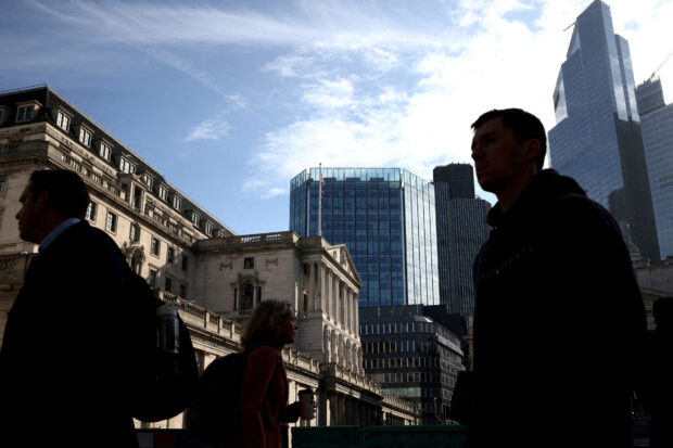 People walking outside the Bank of England in London