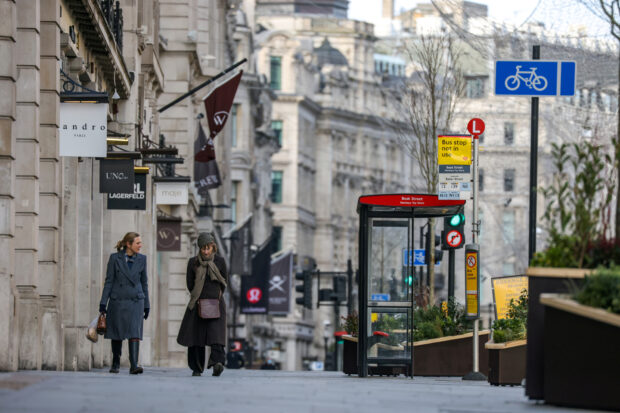 Women walk on Regent Street in London