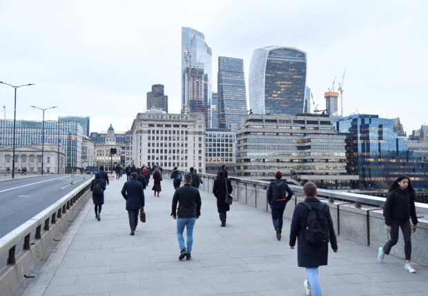 Workers cross London Bridge