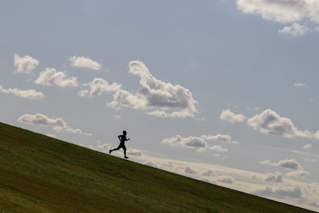 Runner on a hill at Sydney Park
