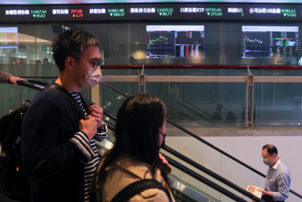 People pass by Taiwan Stock Exchange