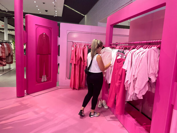 A shopper browse Barbie-themed merchandise at Zara's Soho store in New York