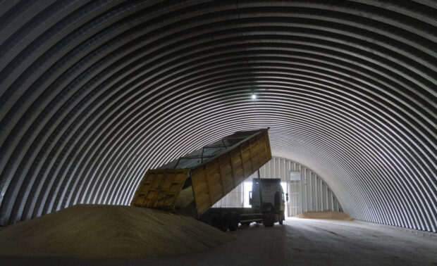 A truck unloading grain in a granary in Zghurivka, Ukraine