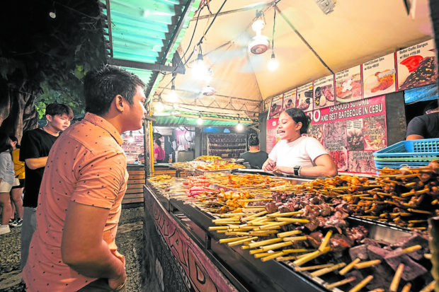 At Sugbo Mercado, barbecued meat on skewers is a staple dish and a crowd favorite.