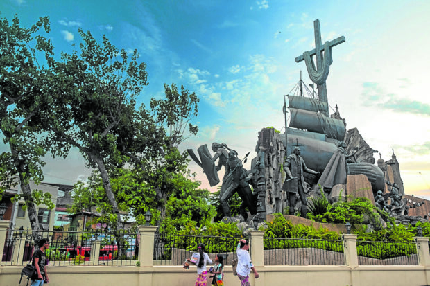 The Heritage of Cebu Monument stands out amid the urban sprawl.