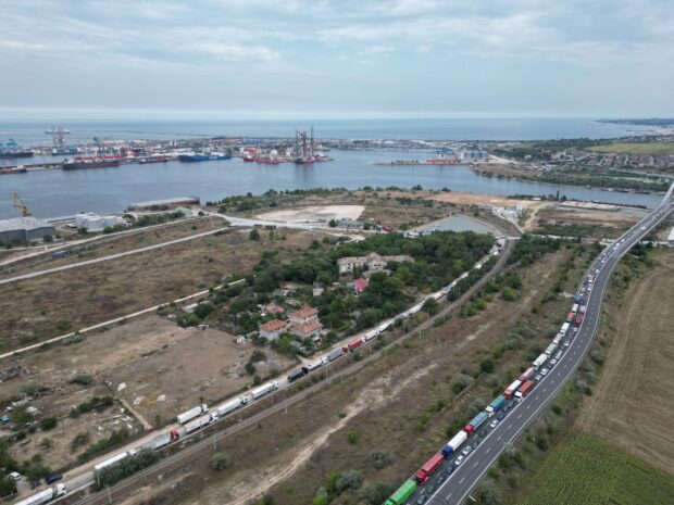 Aerial shots of a four-kilometer queue of grain transporting trucks