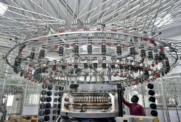 A knitting machine at a textile factory in Hindupur town
