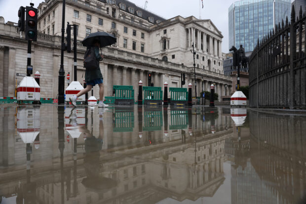 Woman walks near the Bank of England in London
