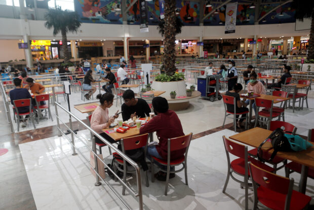 People at a food court in Mumbai