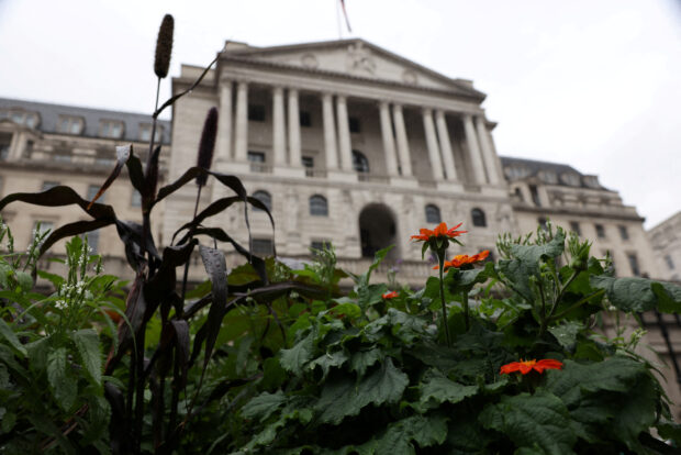 Flowers grow outside the Bank of England in London