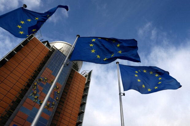 European Union flags flutter outside the EU Commission headquarters in Belgium