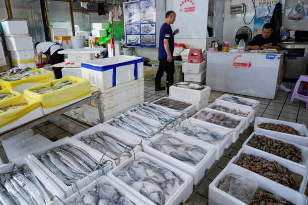 Fish and shrimps are displayed at a seafood market in Shanghai