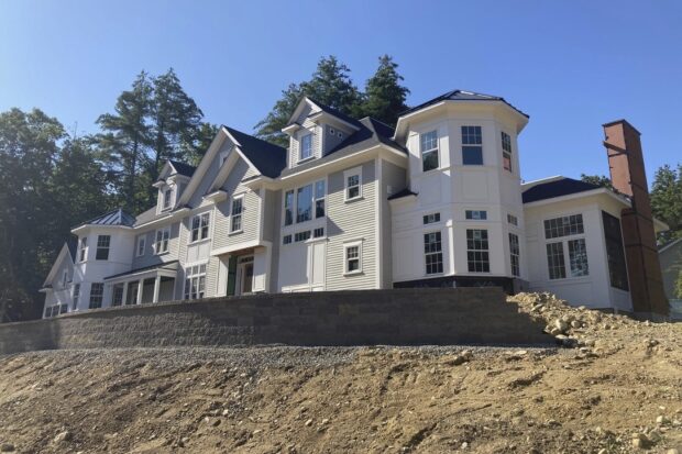 A home under construction is shown on Sunday, Aug. 6, 2023 in Sudbury, Mass. Inflation in the United States rose in July after 12 straight months of declines, boosted by costlier housing. (AP Photo/Peter Morgan)