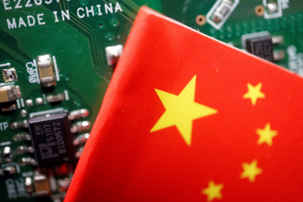 A Chinese flag is displayed next to a "made in China' sign on a printed circuit board