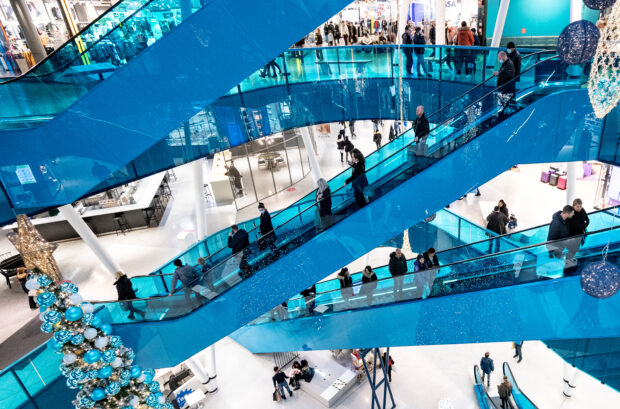 Shoppers on escalators in Emporia shopping center in Malmo, Sweden