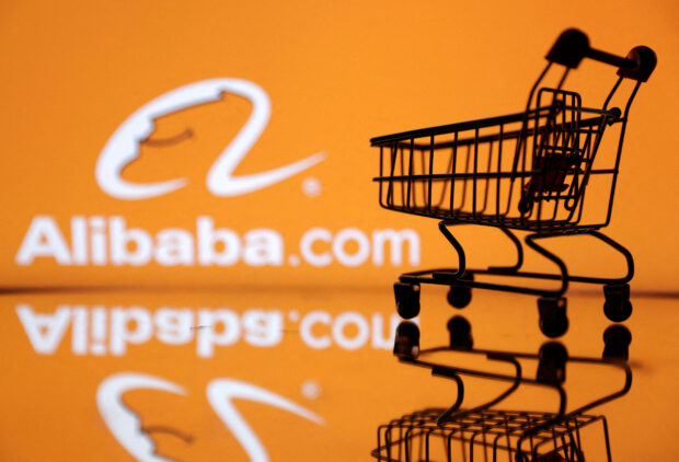 Shopping trolley in front of Alibaba logo